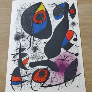 May include: A black and white abstract art print with colorful shapes and a signature by Mir&oacute; in the bottom right corner.
