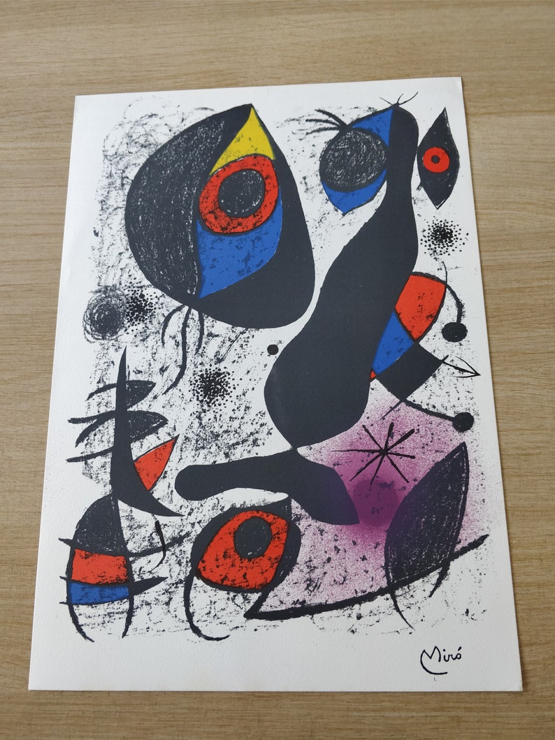 May include: A black and white abstract art print with colorful shapes and a signature by Mir&oacute; in the bottom right corner.