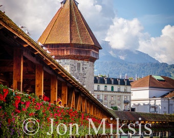 Lucerne, Switzerland -Chapel Bridge with Swiss Alps in the Background - Wooden Footbridge in the Summer