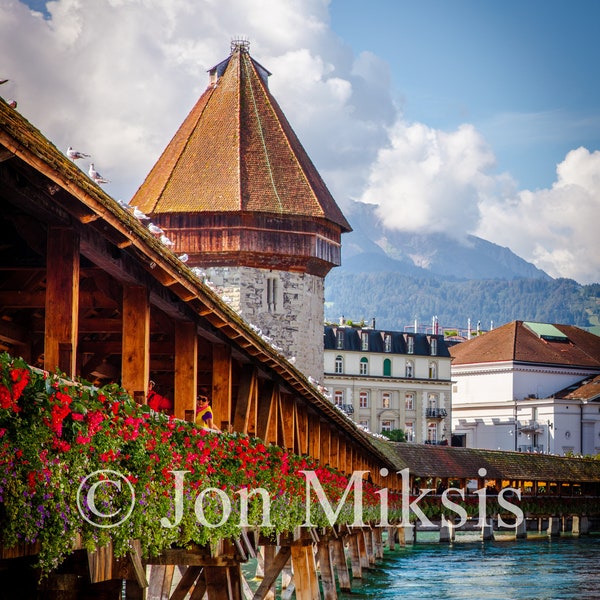 Lucerne, Switzerland -Chapel Bridge with Swiss Alps in the Background - Wooden Footbridge in the Summer