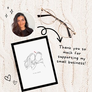 May include: A black framed print with a line drawing of a couple embracing. The drawing is in black and white with red hearts. The date "11.04.2025" is printed below the drawing. The text "Thank you so much for supporting my small business!" is written in black on a white background.