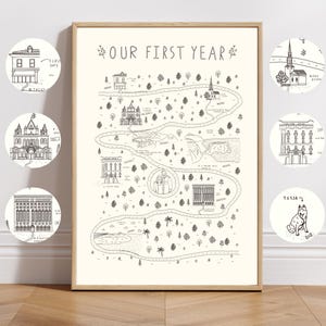 Könnte beinhalten: Ein gerahmter Druck mit einem kartenartigen Design, das eine kurvenreiche Straße und verschiedene Illustrationen von Gebäuden und Wahrzeichen zeigt. Der Text "OUR FIRST YEAR" steht oben. Zusätzliche kreisförmige Illustrationen zeigen ein Haus, eine Kirche und einen Hund namens Tessa.