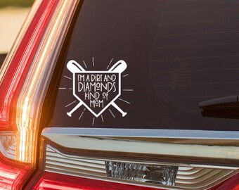 May include: White vinyl decal with a baseball diamond and crossed bats. The text reads "I'm a dirt and diamonds kind of mom".