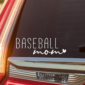May include: White vinyl decal with the text "BASEBALL mom" and a small heart on a black car window.