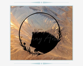 May include: A black silhouette of a hedgehog inside a circular frame, decorated with floral and leaf details. The background has a textured, golden hue. The image is framed with a light blue border and includes the text "Jenny Arts".