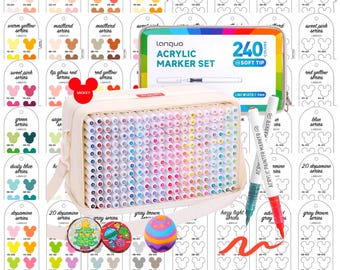 May include: A comprehensive acrylic marker set with 240 soft-tip colors, displayed in a beige carrying case and a metal tin. The set includes color swatches and two acrylic painter markers. The image also features decorative items.