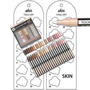 May include: A set of 22 acrylic paint pens in assorted skin tones, labelled "Tool-Art Pro Color Series Acrylic Paint Pens". The pens are arranged in a colour gradient from light to dark. The image also shows a colour chart with the same skin tones, and a single pen with the brand name "Tool-Art" on the side.