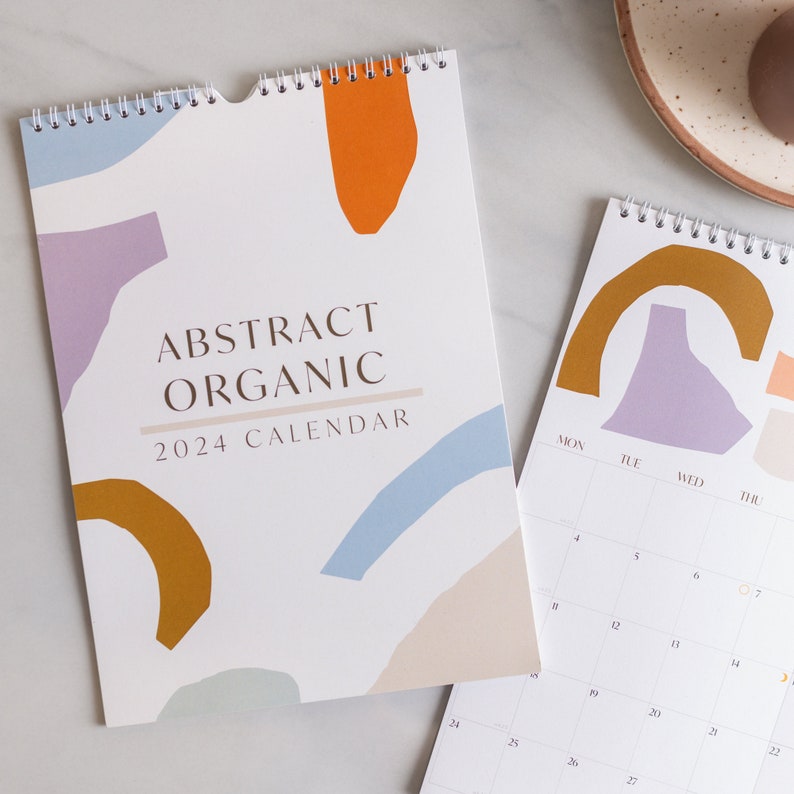 2024 A4 Calendar - abstract, organic designs on each monthly page. 100% Recycled Paper, Made in the UK. Includes week number and moon phases.