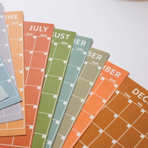 Undated A4 Wall Calendar - 12 separate monthly pages in a surf inspired colour palette. 100% Recycled Paper, Made in the UK.