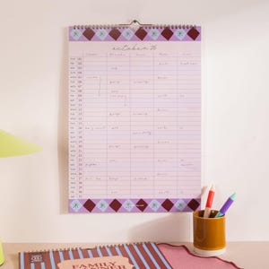 Boho circus family wall planner in use with school events and activities organised