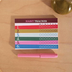 May include: A colorful habit tracker with six rows of circles for each day of the week. The tracker is labeled "HABIT TRACKER" and has the days of the week abbreviated as "m t w t f s s".