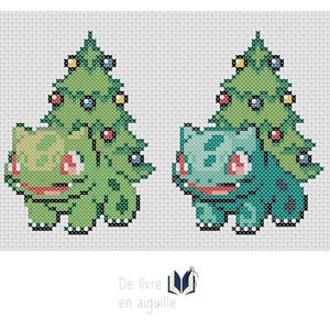 May include: Cross-stitch pattern featuring two Bulbasaur characters, each with a Christmas tree on their back. The Bulbasaur on the left is green, and the one on the right is teal. The trees are decorated with colorful ornaments. The text "De livre en aiguille" is at the bottom.