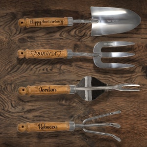 May include: Set of four gardening tools with wooden handles. The handles are engraved with the text "Happy Anniversary", "20/07/24", "Gordon", and "Rebecca".