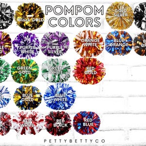 May include: A variety of colorful pom-poms are displayed against a white brick wall. The image showcases pom-poms in various color combinations, including black and silver, gold and silver, and red and blue. Text at the top reads "POMPOM COLORS."