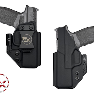 May include: Two black polymer holsters, each containing a semi-automatic pistol. The left holster features a black belt clip with a circular FDK logo in gold. A circular logo with the letters FDK and a stylized American flag design is in the corner.
