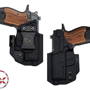 May include: Two black gun holsters with a handgun. The handgun has a black slide and a brown checkered grip. The holsters are made of a durable material and feature a clip for secure attachment. The logo "FDX" is visible on the holster clip.