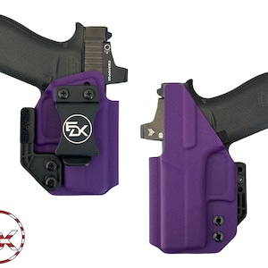 May include: Two images of a black handgun in a purple holster. The holster has a black clip with the letters "FK" inside a circle. The handgun has a red dot sight. The holster is made of a durable material.