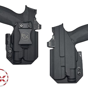May include: Two black gun holsters with attached firearms. The holsters have a clip for attachment and the logo "FX" is visible. The firearms have a red dot sight attached. The image also includes a logo with the letters "FX" inside a circle with red, white, and blue stripes.