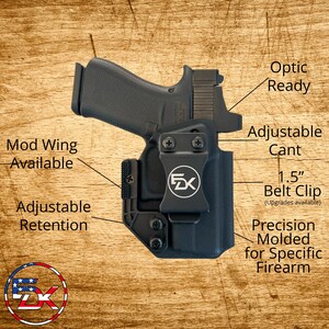 May include: Black firearm holster with the text "Optic Ready", "Adjustable Cant", and "1.5" Belt Clip". Features include "Mod Wing Available", "Adjustable Retention", and "Precision Molded for Specific Firearm". The holster is designed for a specific firearm.
