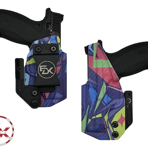 May include: Two black handguns secured in molded holsters featuring a vibrant geometric pattern in shades of blue, green, and pink. Each holster includes a black belt clip with a circular FDK logo and black hardware screws for adjustment.