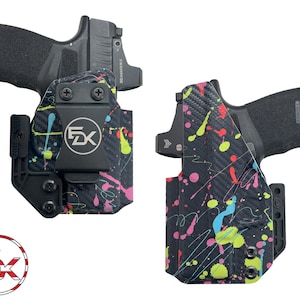 May include: Two black holsters featuring a vibrant neon paint splatter pattern in pink, yellow, and blue. Each holster contains a black firearm with a mounted optic. A circular logo with the letters FDK and a US flag design is in the corner.