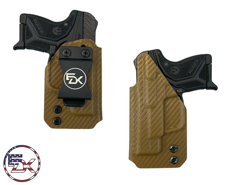 May include: A tan leather holster with a black clip and a black Ruger pistol inside. The holster has a carbon fiber pattern and the clip has the letters "FDX" printed on it.