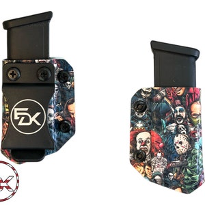 May include: Two black magazine carriers with a colorful horror movie character print. The carriers have a black clip and the text "FDX" in white.