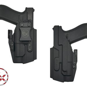 May include: Two black molded polymer holsters, each containing a semi-automatic pistol. The left holster features a belt clip with a circular logo containing the letters FDK. A circular logo with the letters FDK and a US flag pattern is visible.