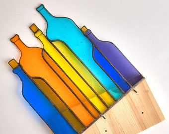 Colorful bottles Stained glass table stand on the wooden platform bright vibrant color pattern desk decor gift