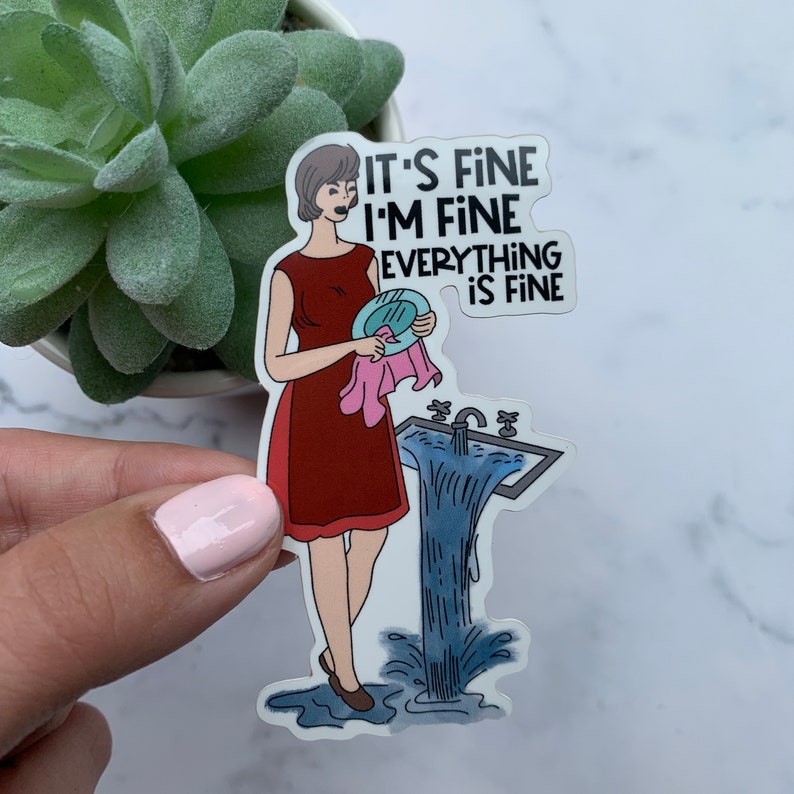 May include: A sticker featuring a woman in a red dress holding a plate and a pink cloth, with a sink overflowing with water. The text on the sticker reads "IT'S FINE I'M FINE EVERYTHING IS FINE."