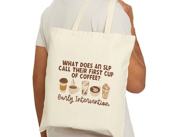 May include: A white tote bag with a brown graphic that says "What does an SLP call their first cup of coffee? Early Intervention". The graphic also includes five different coffee cups.