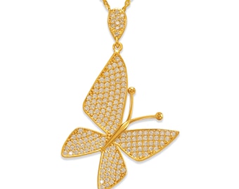 May include: A gold butterfly pendant necklace with clear sparkling stones. The butterfly is detailed with delicate wings and a body.