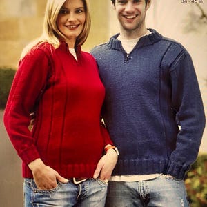 May include: A knitting pattern for a red and blue sweater with a zip. The pattern is called "2869 DK" and is from King Cole.