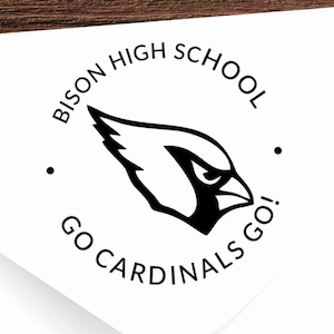 May include: A round, black and white sticker with the text "Bison High School" and "Go Cardinals Go!" around a black cardinal bird illustration.