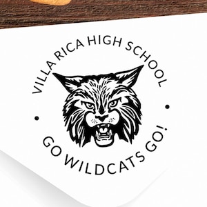 May include: A black and white round sticker with the text "Villa Rica High School" and "Go Wildcats Go!" around a black and white illustration of a wildcat's head.