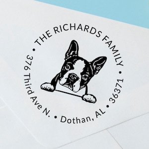 May include: A black and white illustration of a Boston Terrier dog peeking over a circle with the text "The Richards Family" and the address "376 Third Ave N. Dothan, AL 36371."