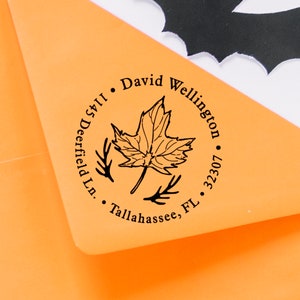 May include: A round return address stamp with a black maple leaf design. The text reads "David Wellington, Deerfield Ln., Tallahassee, FL 32307."