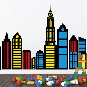 May include: Black and yellow cityscape wall decal with a variety of building shapes and sizes. The decal is perfect for adding a modern touch to any room.