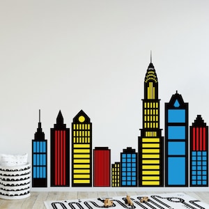 May include: Black silhouette of a city skyline with colorful accents. The buildings are in various heights and have windows and doors. The skyline is perfect for a child's room or playroom.