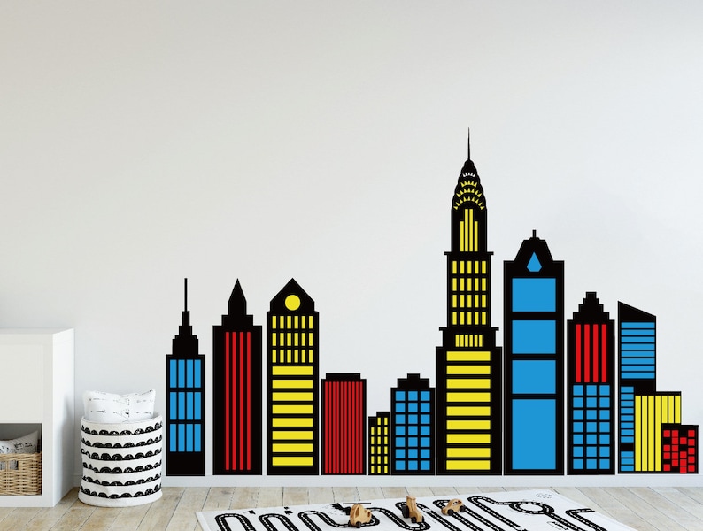 May include: Black silhouette of a city skyline with colorful accents. The buildings are in various heights and have windows and doors. The skyline is perfect for a child's room or playroom.