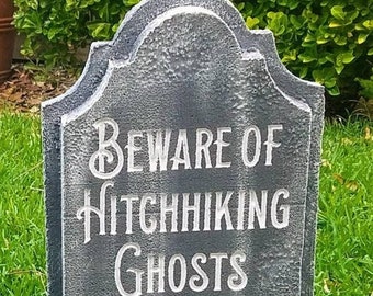 Beware of Hitchhiking Ghosts custom gravestone tombstone. LED Illuminated with 20 color choices. Remote included. Great for Halloween