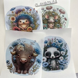 May include: Four illustrated prints featuring whimsical animal characters surrounded by flowers. The prints feature a hedgehog, a mouse, a bison, and a panda.