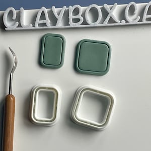 May include: Four silicone molds for making polymer clay jewelry. Two molds are green and two are white. The molds are shaped like squares and rectangles.