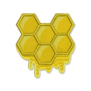 May include: A yellow honeycomb with dripping honey. The honeycomb is made of six hexagonal cells.