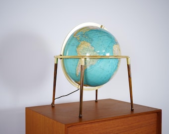 Beautiful globe with a brass frame and four teak legs, dating from the 1960s