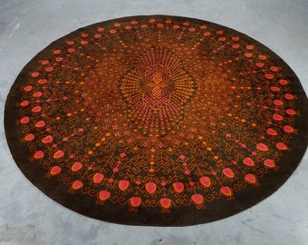 From the 70's round peacock rug in shades of brown and pink