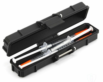 May include: Black rectangular case with an open lid, revealing two syringes with white plungers and orange caps. The case has a secure latch and is designed for storage and protection of medical supplies.