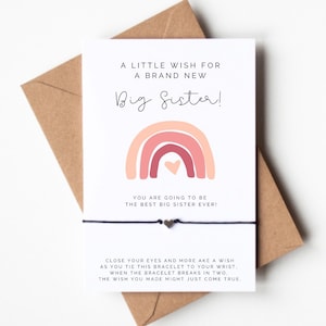 May include: A card with a rainbow design and the text "A little wish for a brand new Big Sister!"  You are going to be the best big sister ever!"  Close your eyes and make a wish as you tie this bracelet to your wrist. When the bracelet breaks in two, the wish you made might just come true.