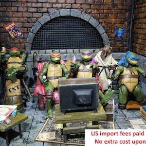 May include: Four Teenage Mutant Ninja Turtles action figures with red, orange, purple, and blue masks sitting in a brick-walled room with a television, a pizza box, and a figure in a beige robe. The scene includes miniature furniture and accessories.
