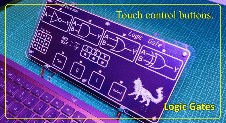 May include: A rectangular black electronic circuit board featuring white printed logic gate diagrams, including NOT, AND, OR, and XOR symbols. The board displays the text Catscat Electronics, Logic Gate, and On/Off, with a cat illustration and touch control buttons.
